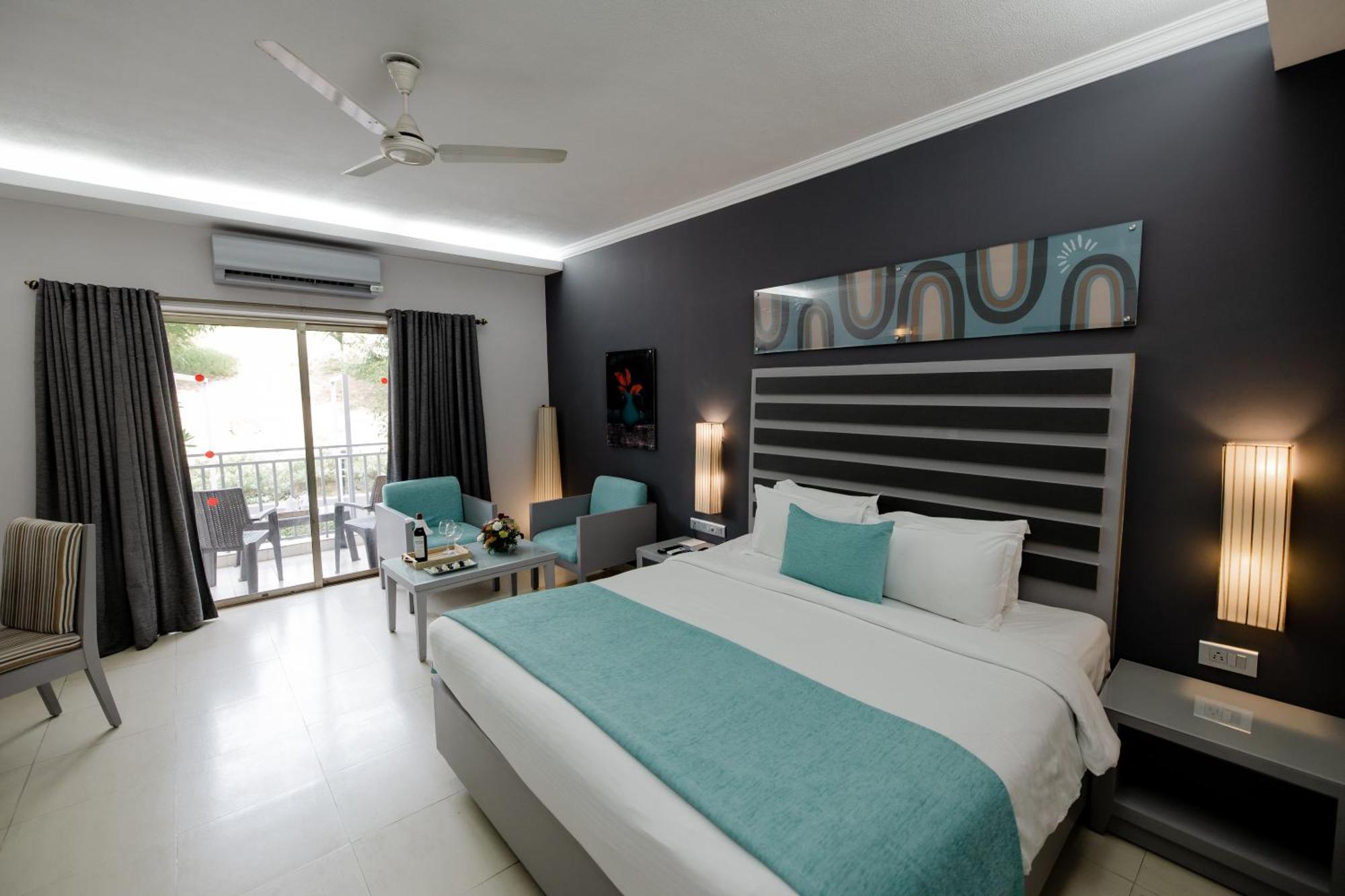 Luxury  Pool View Suite with living room & balcony