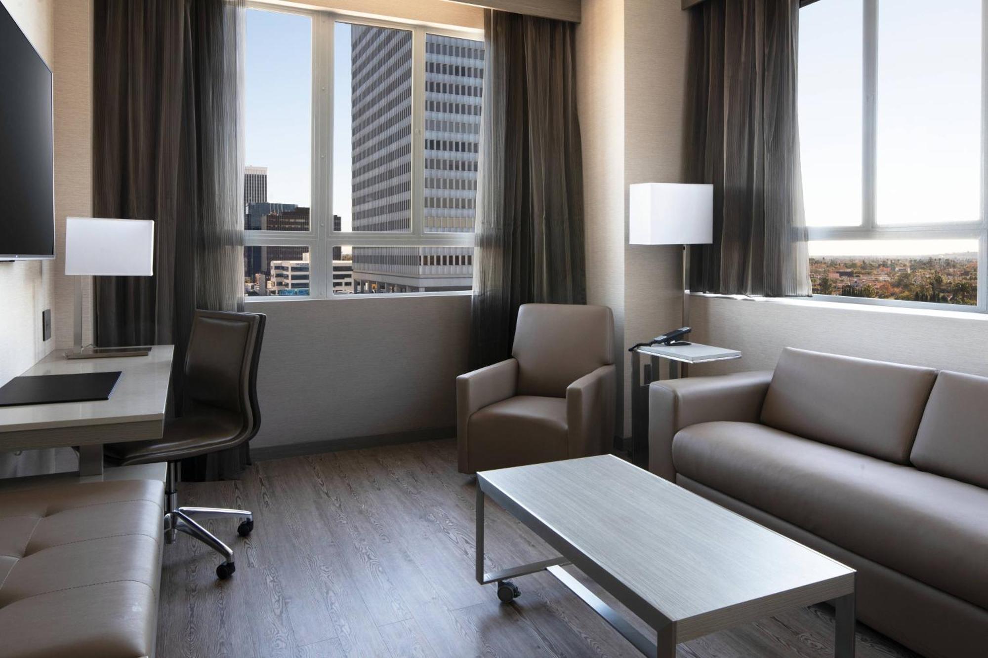 One-Bedroom King Suite with City View and Sofa Bed