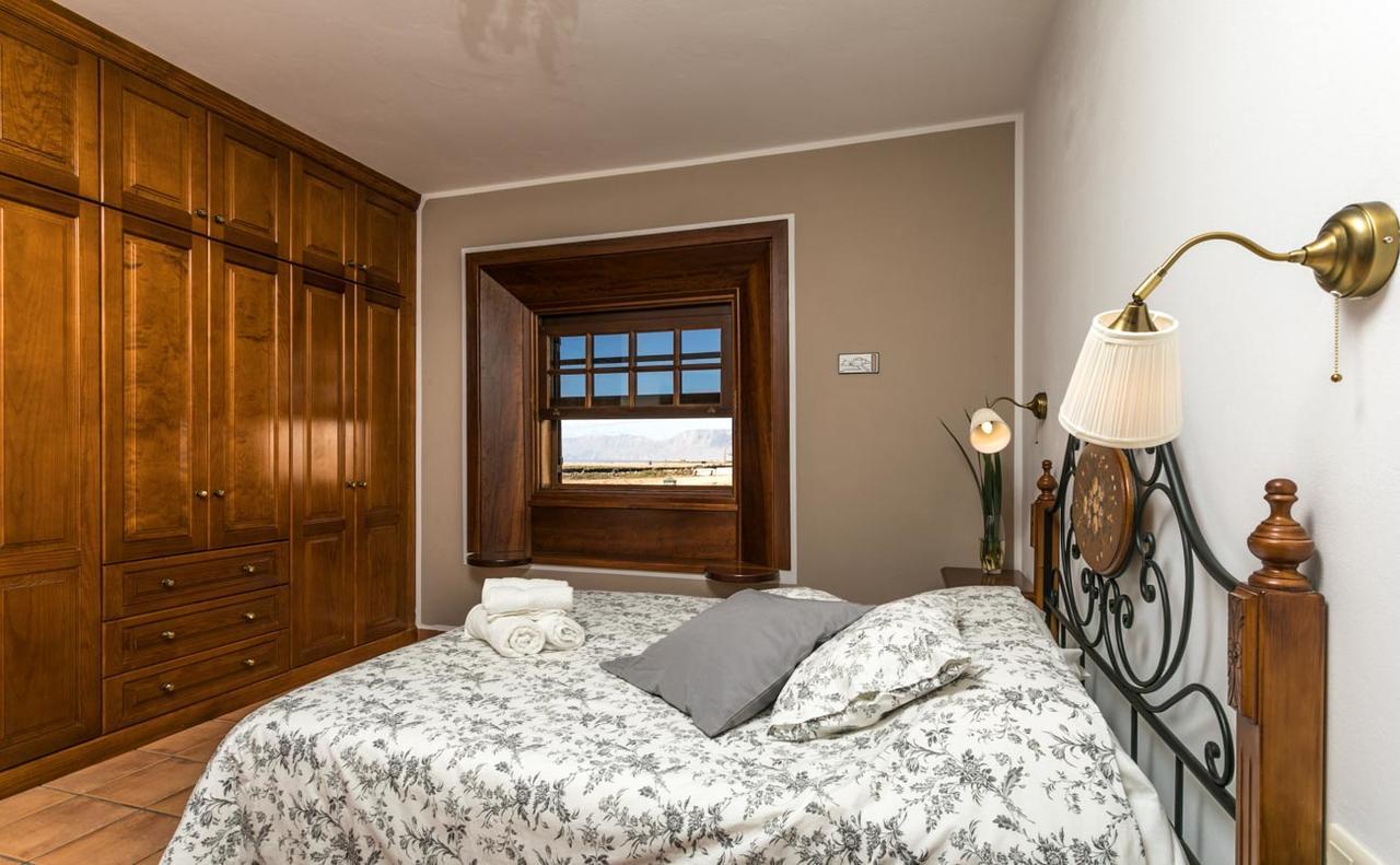 Suite met Queensize Bed en Uitzicht op Zee